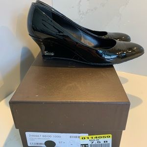 Authentic Gucci black patent leather wedge.
